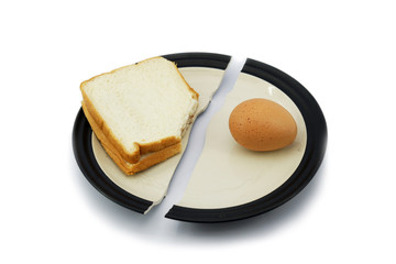 Sandwich bread and egg on a broken plate for diet concept.