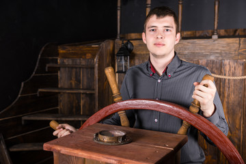 Portrait of Young Man Steering Wooden Ship © kolotype