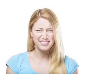 Blonde woman grimacing.