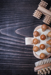 wooden sauna massagers on vintage board with copyspace