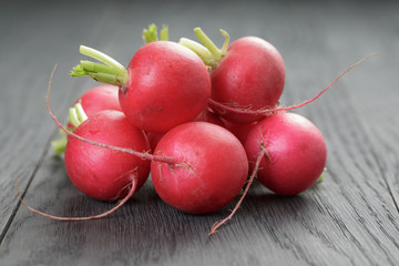freshly harvested radishes on rustic table