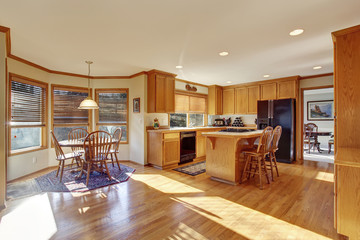 Classic kitchen with hardwood floor and island.