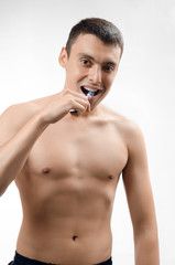 Fototapeta premium man brushing his teeth