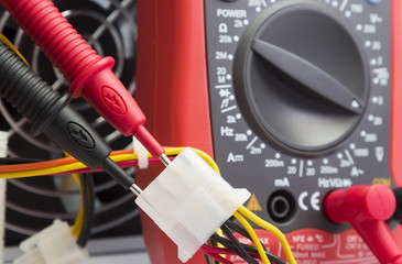 multimeter.measurement of the voltage in the power supply
