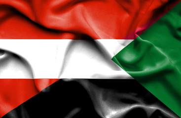 Waving flag of Sudan and Austria