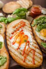 Vatiations of fried eggs inside bread