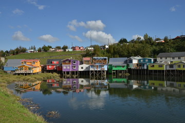 Fototapeta na wymiar Palafitos colored stilt houses in Castro, Chiloe Island, Chile.