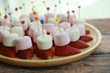 Strawberry and marshmallow on sticks party food