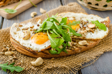 Fototapeta na wymiar Village bread, fried eggs