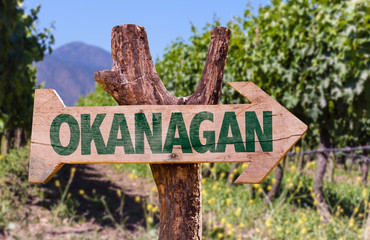 Okanagan wooden sign with winery background
