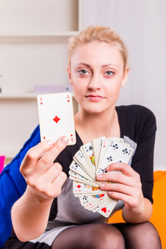 Woman with ace while playing cards