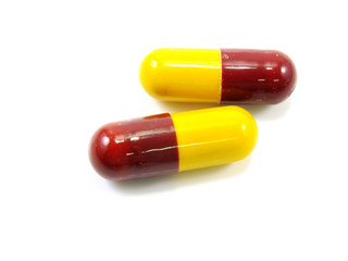 colored capsules closeup on white background