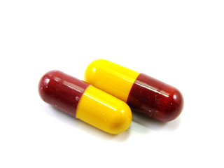 colored capsules closeup on white background