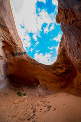 Cave Point Escalante Looking up at the sky from the inside