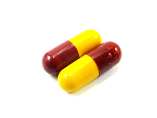 colored capsules closeup on white background