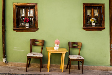 Chairs in front of Green Traditional Turkish House