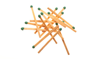 Pile of green wooden matches isolated on white background