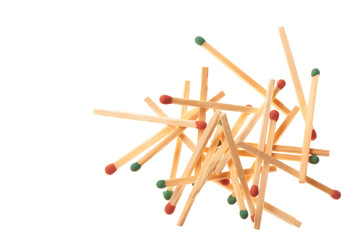 Pile of red and green wooden matche isolated on white