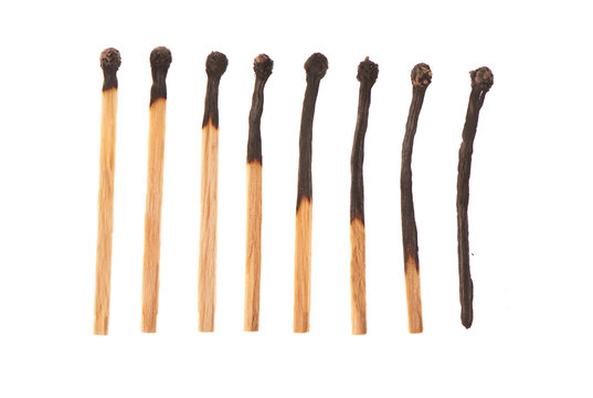 Set of eight burnt wooden matches arranged in ascending order