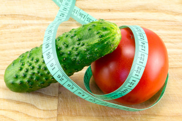 Cucumber and tomato with measuring