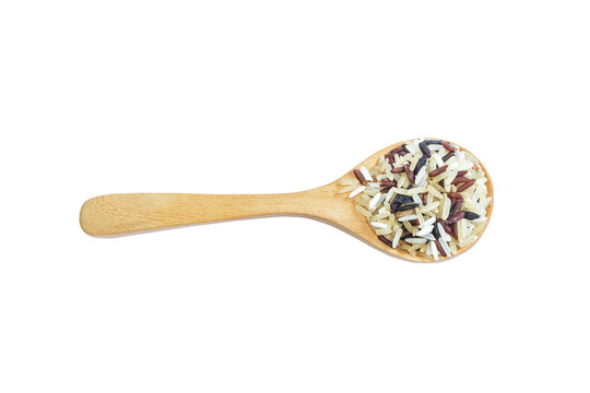 Mix rice on wooden spoon isolate on white background. Product of