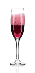 Close up of red champagne glass.