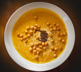 Pumpkin soup with balsamic vinegar, parmesan and back peas