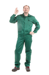 Fototapeta premium Worker in green with ok sign.
