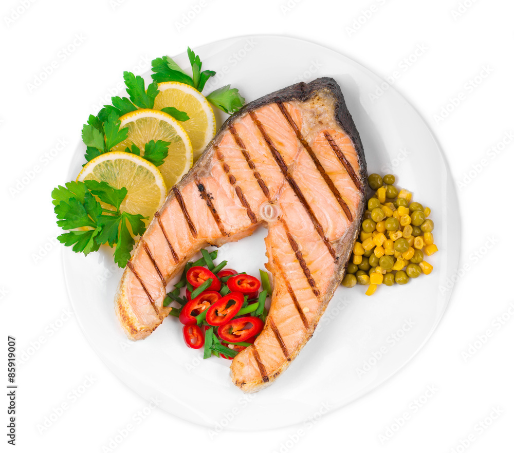 Wall mural Grilled salmon steak with vegetables.