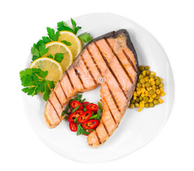 Grilled salmon steak with vegetables.