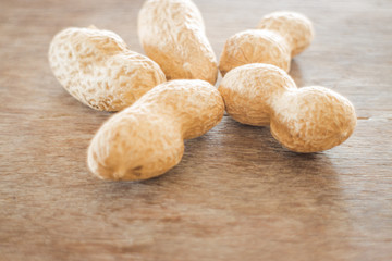 Salted peanuts on weathered wood