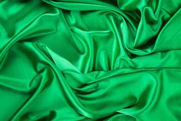 Fototapeta premium Green silk cloth with some folds.