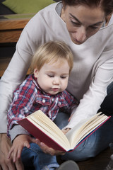 Fototapeta na wymiar baby and mom reading