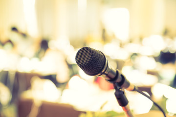Black microphone in   conference room ( Filtered image processed