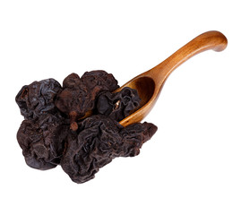 Dried pears in the wooden spoon, isolated on white background.