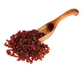Dried barberries in the wooden spoon, isolated on white backgrou