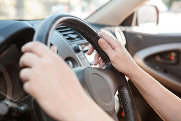 Close-up of woman driving car