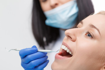 Pretty blond woman during her dentist visit 