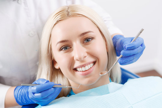 Pretty blond woman during her dentist visit 