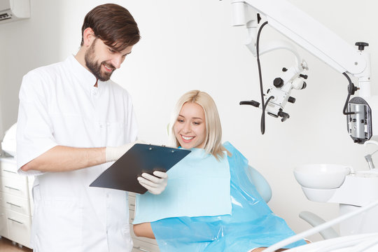 Dentist and his female patient in clinic 