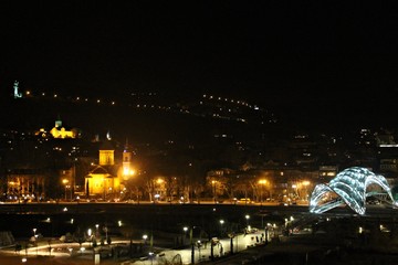 Fototapeta na wymiar night Tbilisi, two churches, Peace bridge