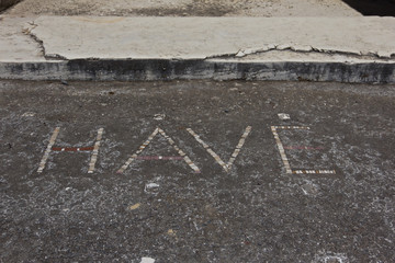 Sign showing the word HAVE or greetings in Latin outside House o