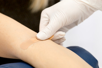 Patch on the arm after taking blood from a vein