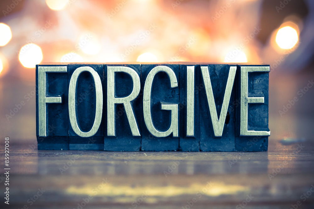 Wall mural forgive concept metal letterpress type