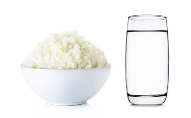 Rice with bowl and water of glass isolated on white