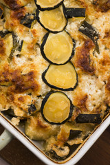 casserole with cheese and zucchini in baking dish