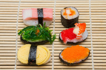 delicious sushi on bamboo mat