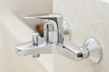 modern faucet on bathtub