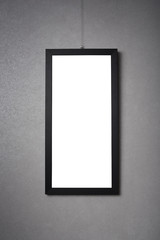 blank black frame on a dark wall