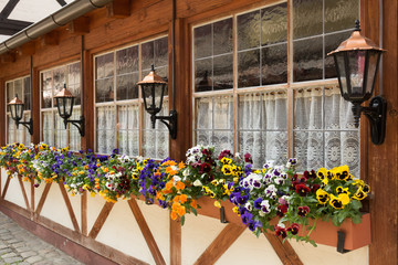 Fototapeta na wymiar window flower boxes in the Handwerkerhof of Nuremberg, Germany